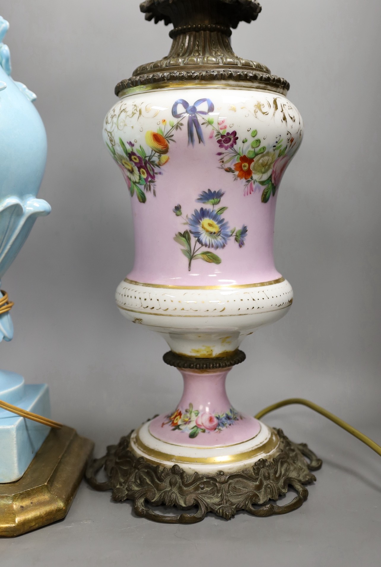 A Victorian brass mounted bone china table lamp and another